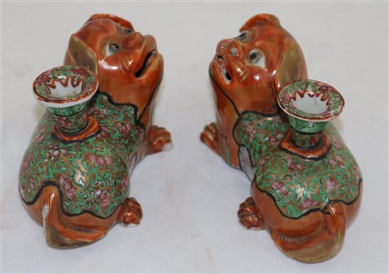 A pair of Chinese export enamelled porcelain Buddhist lion vases, mid 19th century, length 12.5cm